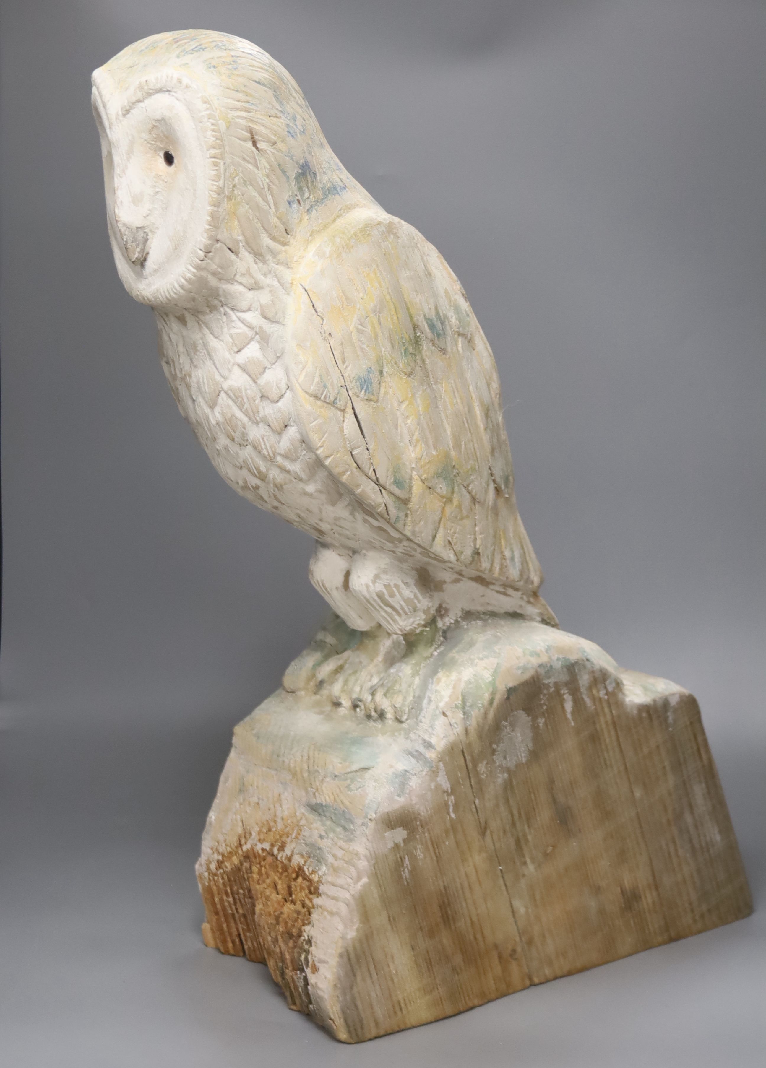 A carved wood owl, 63cm high